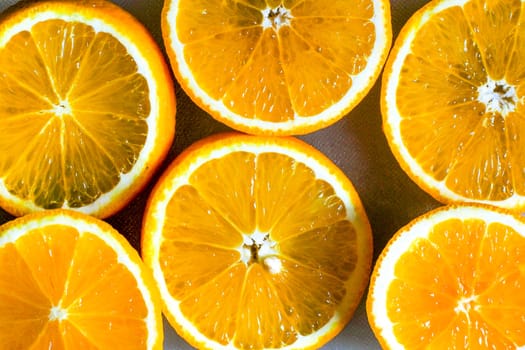 Orange slice background for summer. Background with Citrus-fruit Of Orange Slices. Juicy Slice of Orange