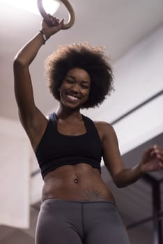 Fitness dip ring beautiful young african american woman workout at gym dipping exercise