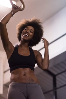 Fitness dip ring beautiful young african american woman workout at gym dipping exercise