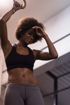 Fitness dip ring beautiful young african american woman workout at gym dipping exercise