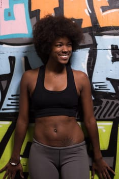 portrait of a young beautiful African American women in sports clothes after a workout at the gym