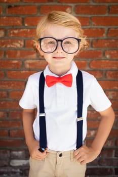 Cute Young Caucasian Boy Wearing Glasses and Red, White and Blue