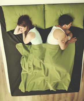 happy young couple in bed at morning
