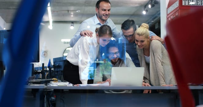 Group of a young business people discussing business plan at modern startup office building
