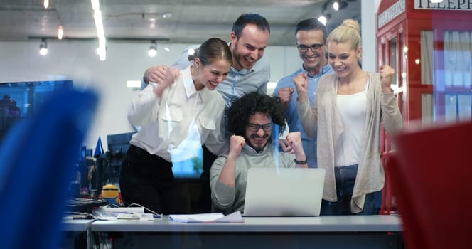 Group of a young business people discussing business plan at modern startup office building