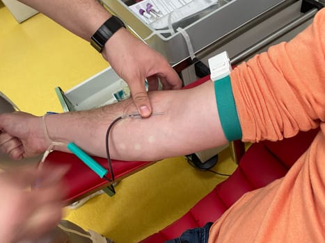 Close up nurse hand collecting blood sample for diagnosis covid-19, Coronavirus.Laboratory technician taking blood for blood chemistry diagnosis by automatic machine. High quality photo
