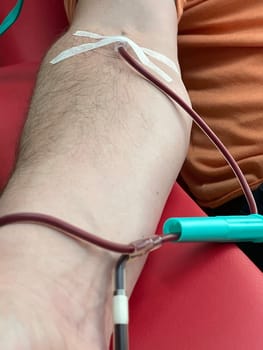 Close up nurse hand collecting blood sample for diagnosis covid-19, Coronavirus.Laboratory technician taking blood for blood chemistry diagnosis by automatic machine. High quality photo