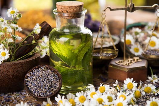 Oil and Natural medicine, wooden table background