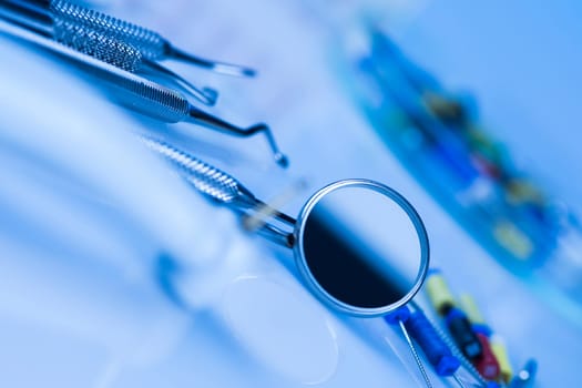 Dentist equipment on blue background