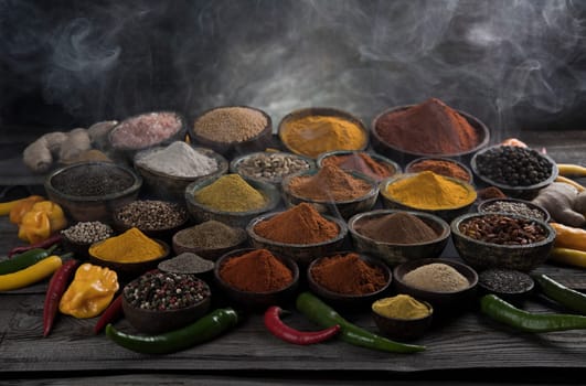 Variety of spices and herbs on kitchen table