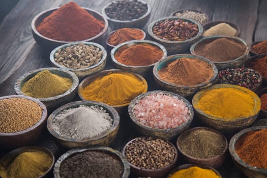 Aromatic spices on wooden background