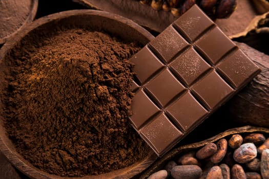 Chocolate bar, candy sweet, cacao beans and powder