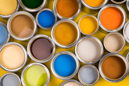 Open buckets with a paint, colors background