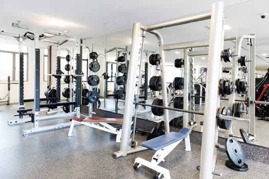 Weight lifting equipments in a club gym.