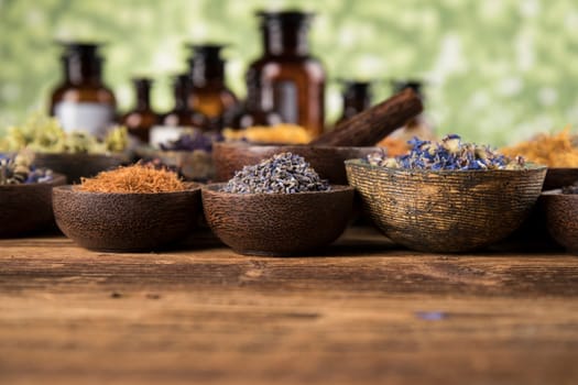 Herbs medicine and vintage wooden background