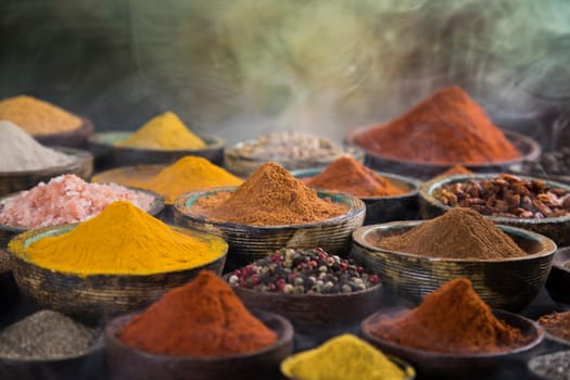 Smoke, Aromatic spices on wooden background
