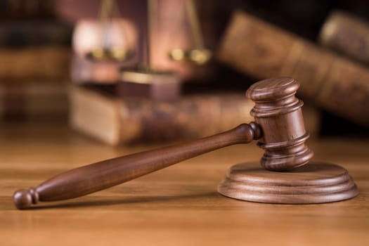 Law theme, mallet of judge, wooden gavel, globe background