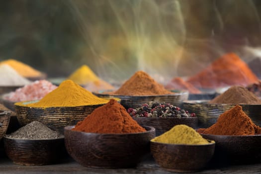 Assorted Spices and wooden bowl of smoke