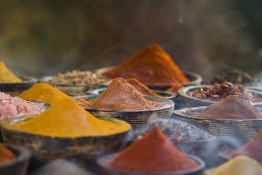 Smoke, Aromatic spices on wooden background