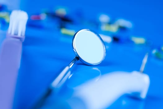 Dentist equipment on blue background