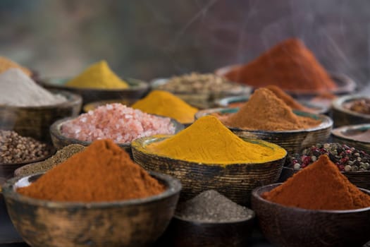 Smoke, Aromatic spices on wooden background