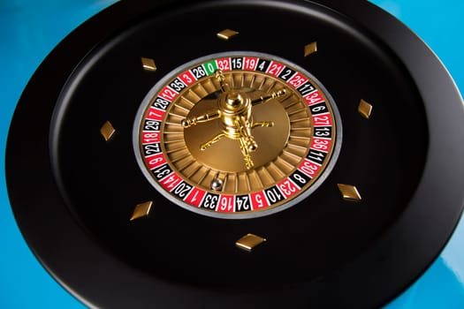 Roulette wheel in motion, casino background