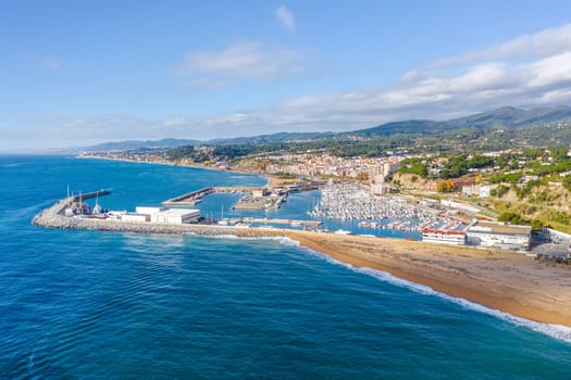 Aerial panoramic view of Arenys de Mar city at dawn. Located in El Maresme, Barcelona, Spain