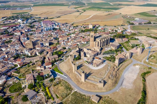 View of Artajona city with san Pedro church from fortress, Navarra Spain