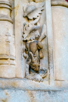 The famous lucky rabbit carved in stone on the Salamanca Cathedral facade.