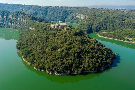 Aerial view of a Benedictine monastery of Sant Pere de Casserres on the Ter river.