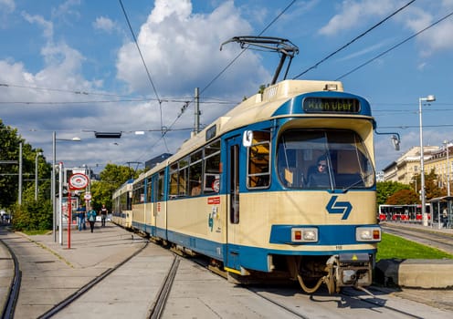 Vienna, Austria - September 16, 2019: people in streetcar in the Hofburg - with history dating back to mid-19th century. It is located in centre of Vienna