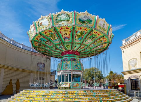Vienna, Austria - September 18, 2019: The Vienna Prater is a modern theme park with over 250 attractions that provide adrenaline. View of ferris wheel carousel