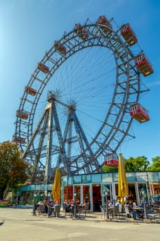 Vienna, Austria - September 18, 2019: The Vienna Prater is a modern theme park with over 250 attractions that provide adrenaline. Prater Ferris Wheel - icon of city
