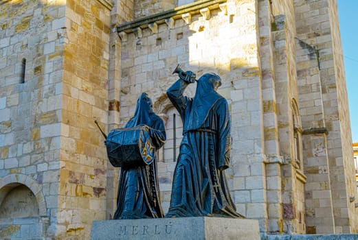 Zamora, Spain - January 6, 2019: Main facade of Church of San Juan Bautista in mayor square of Zamora with a Merlu easter statue. Castilla and Leon Spain.