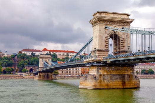 Budapest, Hungary - November 15, 2019: Chain Bridge is a chain bridge that spans the River Danube between Buda and Pest, the western and eastern sides of Budapest
