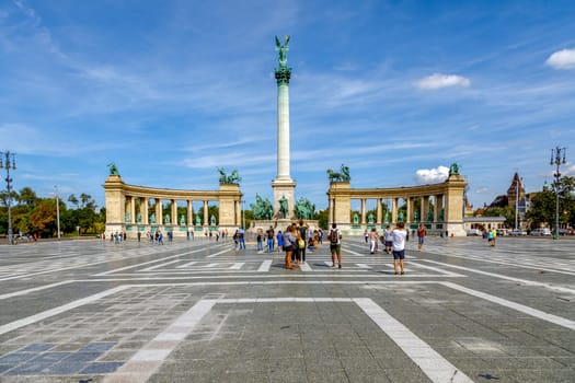 Budapest, Hungary - November 15, 2019: Many tourists stroll on the Heroes Square. Is one of the most-visited attractions in Budapest squares in Budapest, Hungary.