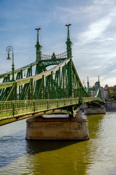 Budapest, Hungary - November 15, 2019: The Liberty Bridge in Budapest in Hungary, it connects Buda and Pest cities across the Danube river. shortest bridge in Budapest city.