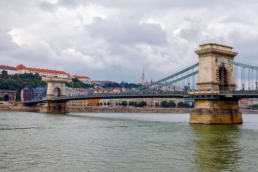 Budapest, Hungary - November 15, 2019: Chain Bridge is a chain bridge that spans the River Danube between Buda and Pest, the western and eastern sides of Budapest