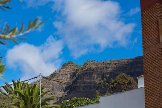 Mountains on the coast between Puerto de Mogan and Puerto Rico. Layers of volcanic rock.