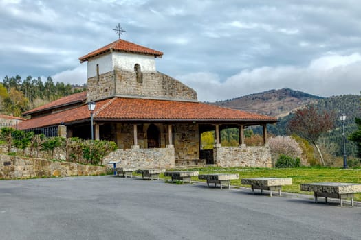 Bakio, Spain - April 08, 2018: hermitage of San Pelayo (San Pelaio baseliza) in Baquio (Vizcaya, Spain) is a Romanesque hermitage that is located in the way that, bordering the coast