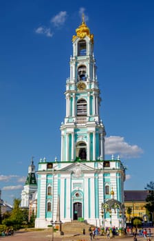 Sergiev Posad, Russia - September 14, 2018: Tourists and parishioners around the bell tower. Holy Trinity-St. Sergiev Posad. Moscow region