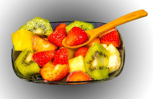 fresh fruit macedonia cut into cubes, Isolated gradient background with spoon