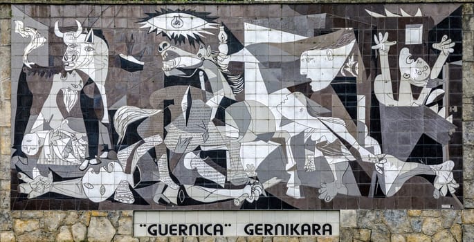 Guernica, Spain - April 09, 2018: A tiled wall in Gernika reminds of the bombing during the Spanish Civil War.Painting 1937 by Pablo Picasso