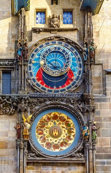 Prague, Czech republic - September 12, 2019: Beautiful big vintage clock with arrows and decorations in the form of figures and stucco in the center of Prague. Famous astronomical mechanical clock on tower in old town
