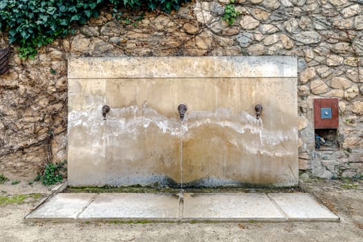 Monastery of Santa Maria de Poblet, Catalonia, Spain Fountain washes feet for pilgrims