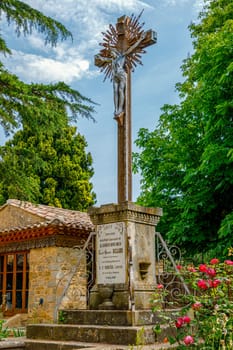 Church of Rennes le Chateau, France. Detail of the Statue of Cross, and Jesus Christus