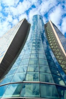 High glass skyscraper in Warsaw. Modern architecture of city buildings. Business center with modern buildings in Warsaw. Skyscrapers in city