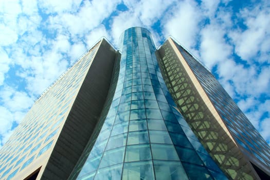 High glass skyscraper in Warsaw. Modern architecture of city buildings. Business center with modern buildings in Warsaw. Skyscrapers in city