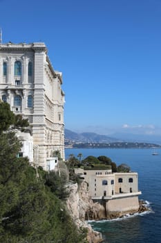 Monaco - February 20, 2021: Oceanographic Museum Building (Musée Océanographique) With A Beautiful View Of The Mediterranean Sea And Cap Martin In The Background, Monaco On The French Riviera, Europe