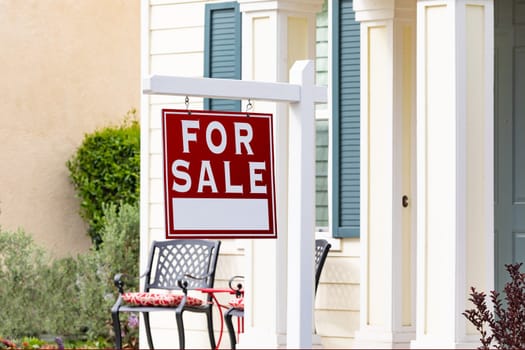 Home For Sale Real Estate Sign in Front of New House.